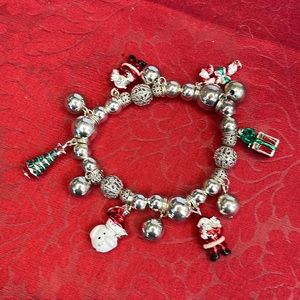CHRISTMAS silver tone bracelet with holiday charms, never worn